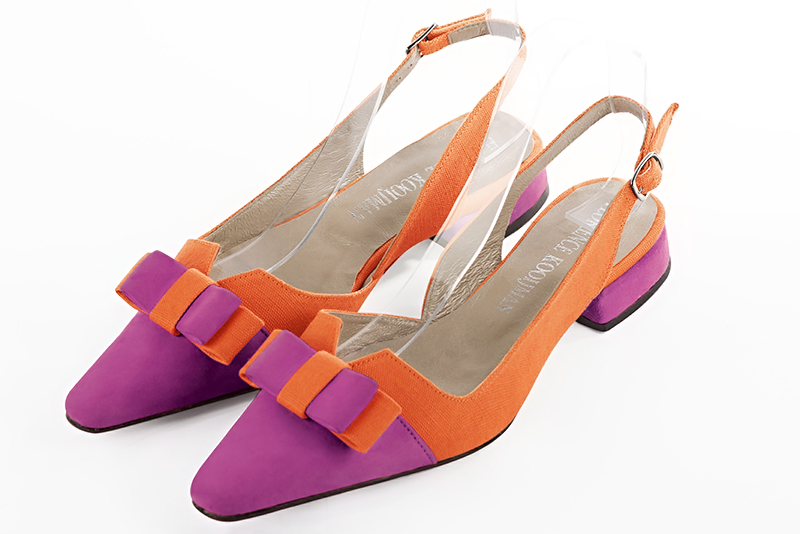 Shocking pink and clementine orange women's open back shoes, with a knot. Tapered toe. Flat block heels. Front view - Florence KOOIJMAN